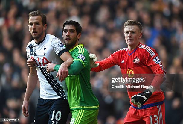 Harry Kane of Tottenham Hotspur, Danny Graham and Jordan Pickford of Sunderland in action during the Barclays Premier League match between Tottenham...