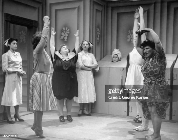 Actress & writer Gertrude Berg and other actors performing in a scene of the TV program The Goldbergs.