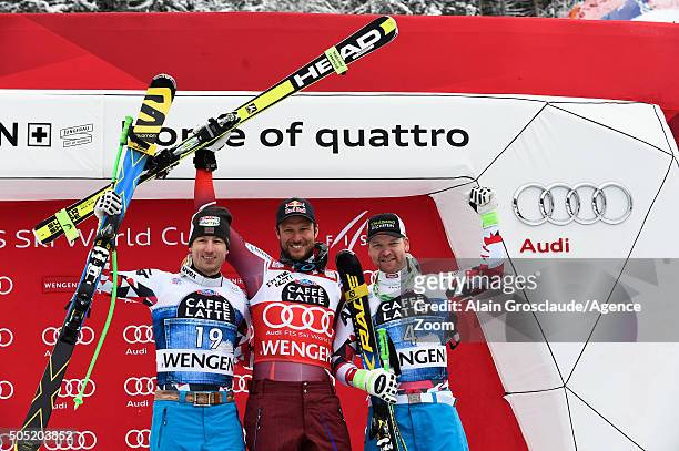 Hannes Reichelt of Austria takes 2nd place, Aksel Lund Svindal of Norway takes 1st place and Klaus Kroell of Austria takes 3rd place during the Audi...