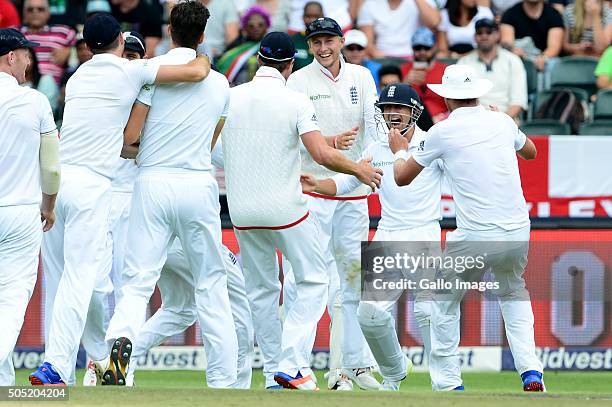 James Taylor of England celebrates the wicket of Dane Vilas of the Proteas with his team mates during day 3 of the 3rd Test match between South...