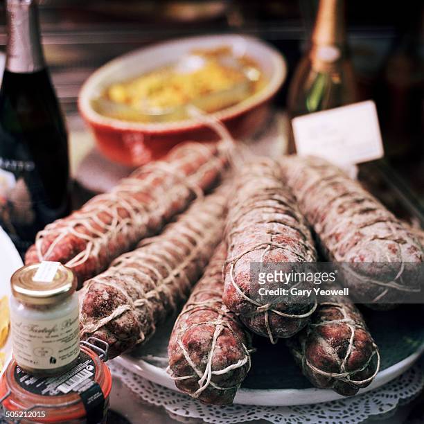 traditional italian sausage in shop display - bergamo stock photos et images de collection