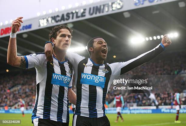 Georginio Wijnaldum of Newcastle United celebrates scoring his team's second goal with his team mate Daryl Janmaat during the Barclays Premier League...