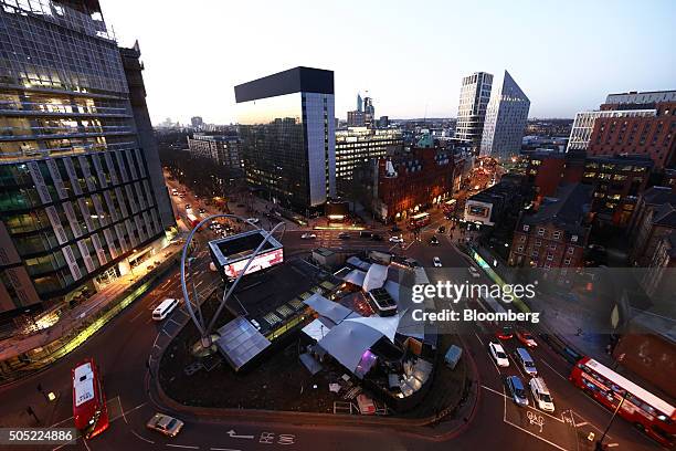 Traffic passes around the Old Street roundabout, also referred to as 'Silicon Roundabout,' in the area known as 'Tech City' at dusk, in London, U.K.,...