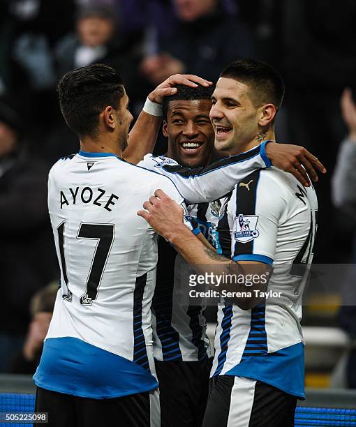 Georginio Wijnaldum of Newcastle celebrates with teammates Aleksandar Mitrovic and Ayoze Perez after scoring their second goal during the Barclays...