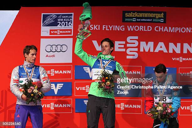 Peter Prevc of Slovenia takes gold medals, Kenneth Gangnes of Norway takes silver medals, Stefan Kraft of Austria takes bronz medals during the FIS...