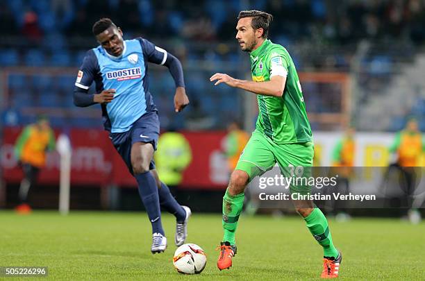 Martin Stranzl of Borussia Moenchengladbach is chased by Peniel Mlapa of VfL Bochum during the friendly match between VfL Bochum and Borussia...