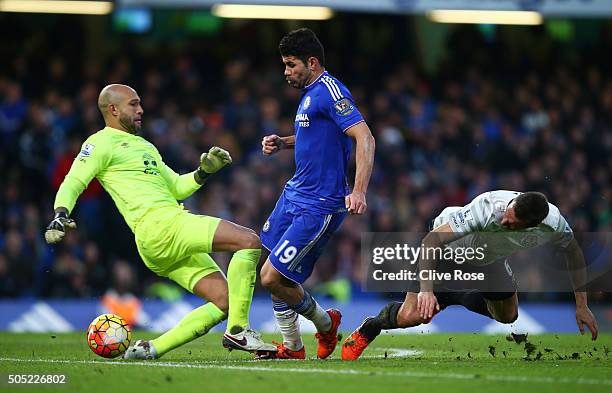 Diego Costa of Chelsea rounds Tim Howard and Phil Jagielka of Everton to score his team's first goal during the Barclays Premier League match between...