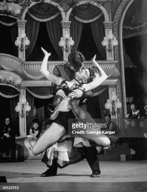 Actress Allyn McLerie and Actor Tommy Rall performing a dance routine in scene from show Miss Liberty.
