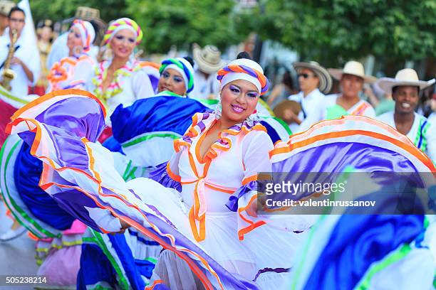 colombian group performing in festival's parade - colombia dance stock pictures, royalty-free photos & images