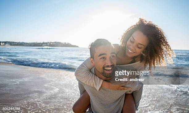 loving couple at the beach - australian beach stockfoto's en -beelden