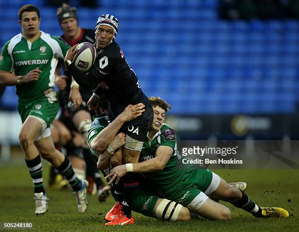 Gio Aplon of Grenoble is tackled by Theo Brophy Clews of London Irish during the European Rugby Challenge Cup match between London Irish and Grenoble...