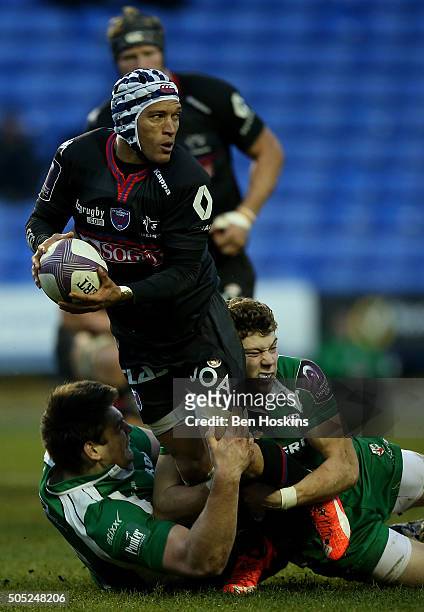 Gio Aplon of Grenoble is tackled by Theo Brophy Clews of London Irish during the European Rugby Challenge Cup match between London Irish and Grenoble...