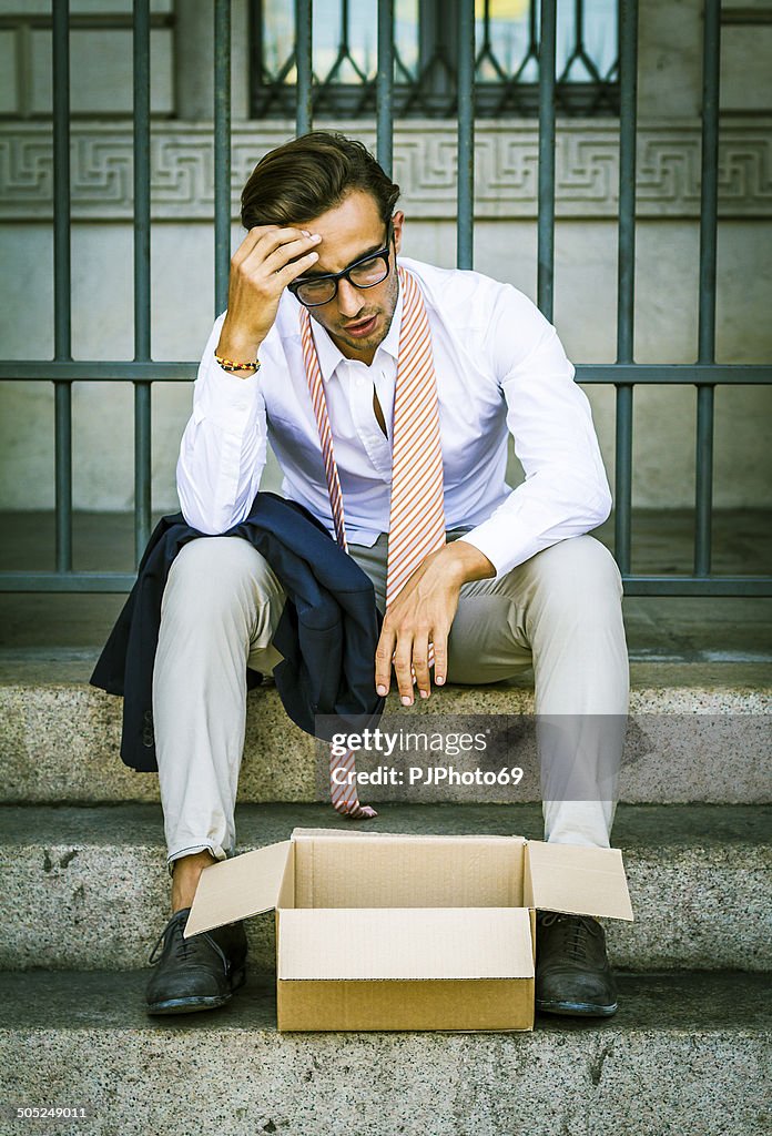 Young businessman losing his job