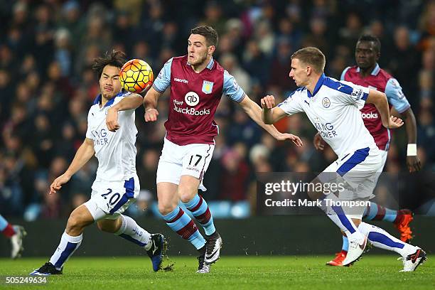Jordan Veretout of Aston Villa competes against Shinji Okazaki and Marc Albrighton of Leicester City during the Barclays Premier League match between...
