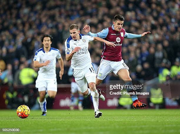 Marc Albrighton of Leicester City in action with Ashley Westwood of Aston Villa during the Premier League match between Aston Villa and Leicester...
