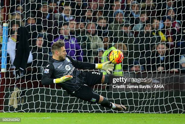 Mark Bunn of Aston Villa saves a penalty from Riyad Mahrez of Leicester City during the Barclays Premier League match between Aston Villa and...