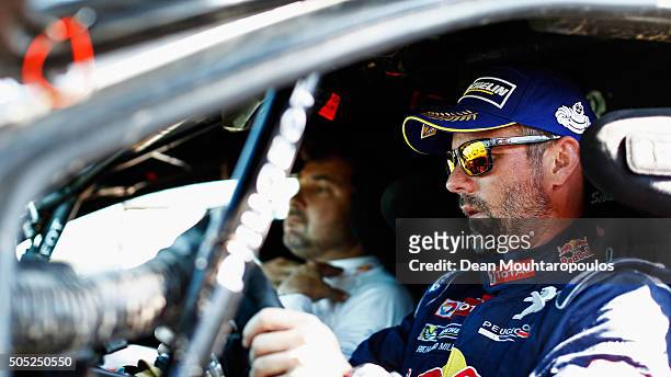 Sebastien Loeb of France in the PEUGEOT 2008 DKR for TEAM PEUGEOT TOTAL arrives at the end of stage thirteen between Villa Carlos Paz and Rosario on...