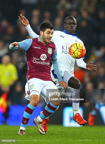 Carles Gil of Aston Villa and Ngolo Kante of Leicester City compete for the ball during the Barclays Premier League match between Aston Villa and...