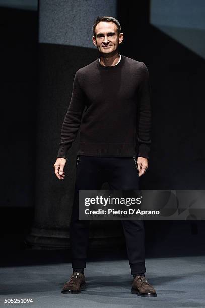 Designer Neil Barrett acknowledges the applause of the public after the Neil Barrett show during Milan Men's Fashion Week Fall/Winter 2016/17 on...