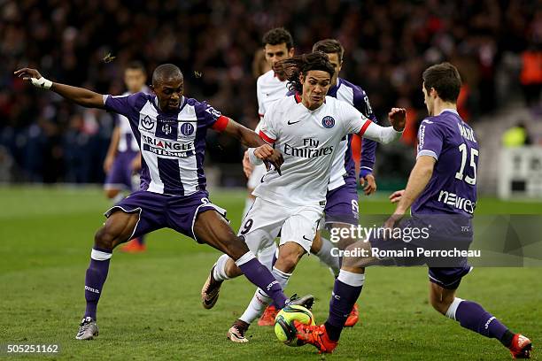 Edinson Cavani for Paris Saint Germain battle for the ball with Jean Daniel Akpa Akpro for Toulouse FC during the French Ligue 1 football match...