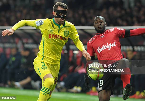 Guingamp's French forward Yannis Salibur vies with Nantes' Albanian defender Ermir Lenjani during the French L1 football match Guingamp vs Nantes on...