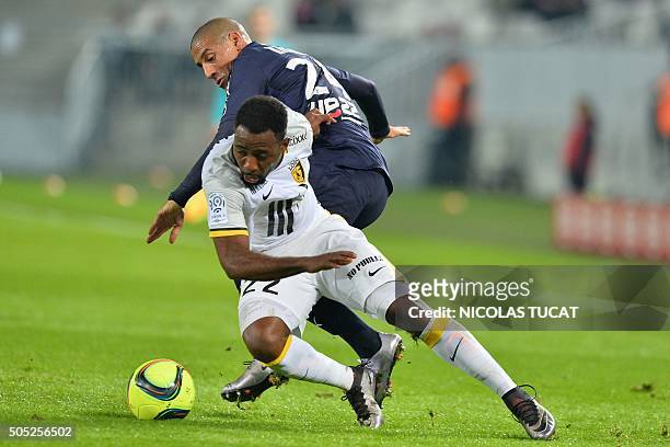 Lille's Ivorian forward Junior Tallo vies with Bordeaux's Tunisian midfielder Wahbi Khazri during the French Ligue 1 football match between Bordeaux...