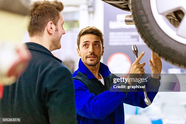auto mechanic talking with car owner - conversation car bildbanksfoton och bilder