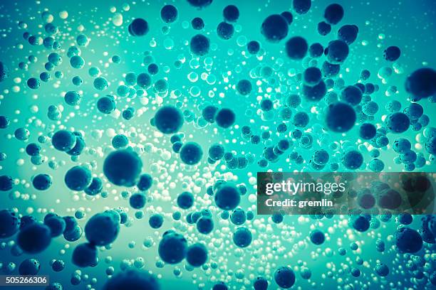 tiny, reflective cells with center illumination - proton stock pictures, royalty-free photos & images