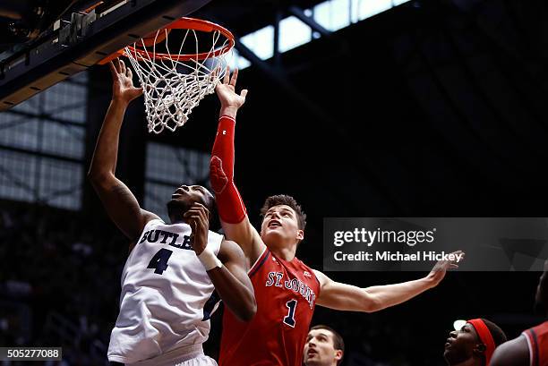 Tyler Wideman of the Butler Bulldogs shoots the ball as Amar Alibegovic of the St. John's Red Storm defends at Hinkle Fieldhouse on January 16, 2016...