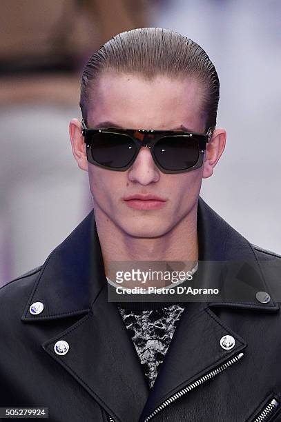 Model, details, walks the runway at the Versace show during Milan Men's Fashion Week Fall/Winter 2016/17 on January 16, 2016 in Milan, Italy.