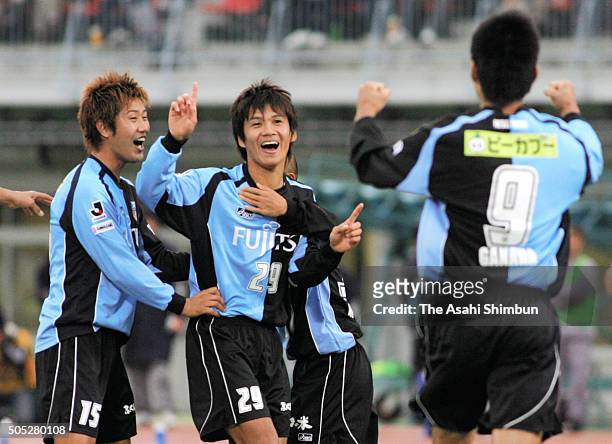 Hiroyuki Taniguchi of Kawasaki Frontale celebrates scoring his team's second goal with his team mates during the J.League match between Kawasaki...