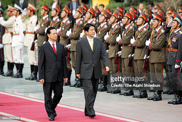 Japanese Prime Minister Shinzo Abe and Vietnamese Prime Minister Nguyen Tan Dung attend the welcome ceremony on the sidelines of the APEC Summit at...