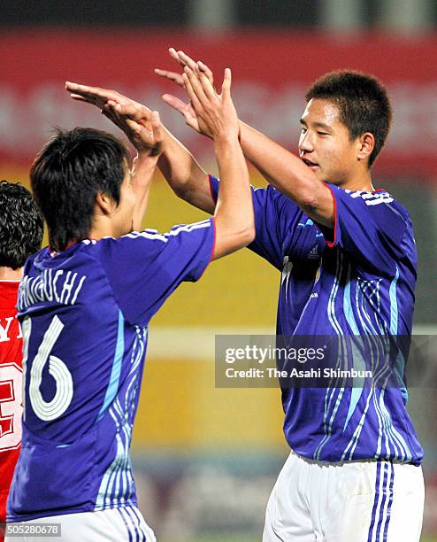 Sota Hirayama and Hiroyuki Taniguchi of Japan celebrate their 1-0 win in the Football Men's Group F match between Syria and Japan during day two of...