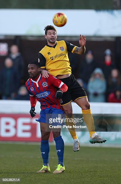 Marc Richards of Northampton Town contests the ball with Andre Boucaud of Dagenham & Redbridge during the Sky Bet League Two match between Dagenham &...