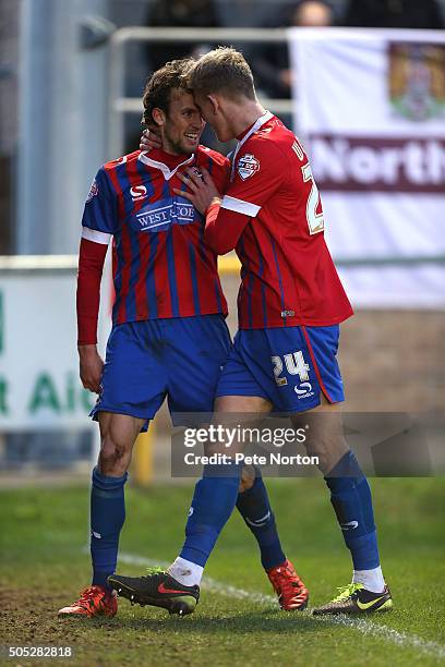 Christian Doidge of Dagenham & Redbridge celebrates with team mate Joe Worrall after scoring his sides goal during the Sky Bet League Two match...