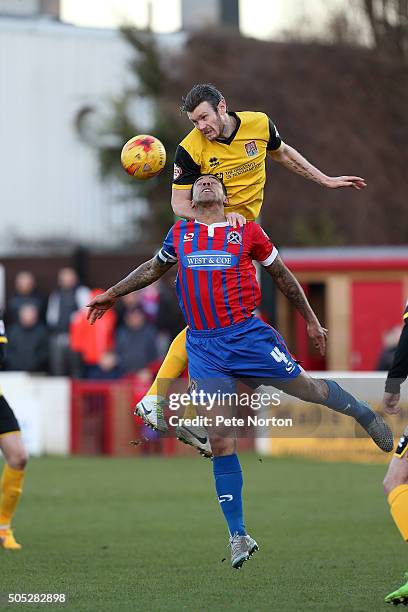 Zander Diamond of Northampton Town rises above Joss Labadie of Dagenham & Redbridge to head the ball during the Sky Bet League Two match between...