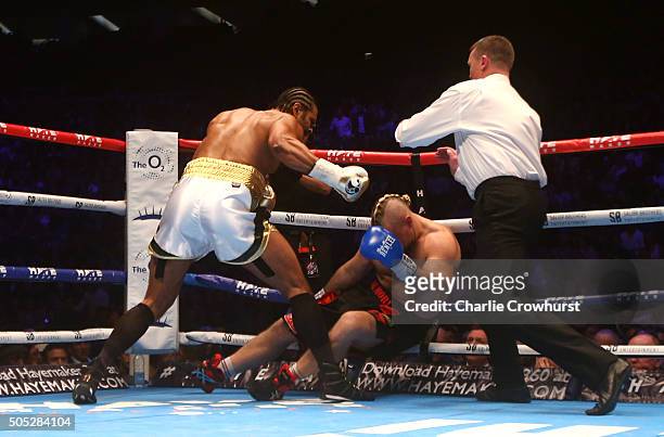 David Haye of England is pushed away by the referee after knocking out Mark De Mori of Australia during their International heavyweight contest at...