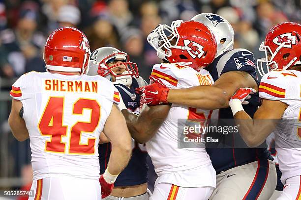 Danny Amendola of the New England Patriots shoves Dezman Moses of the Kansas City Chiefs after a play in the second quarter during the AFC Divisional...