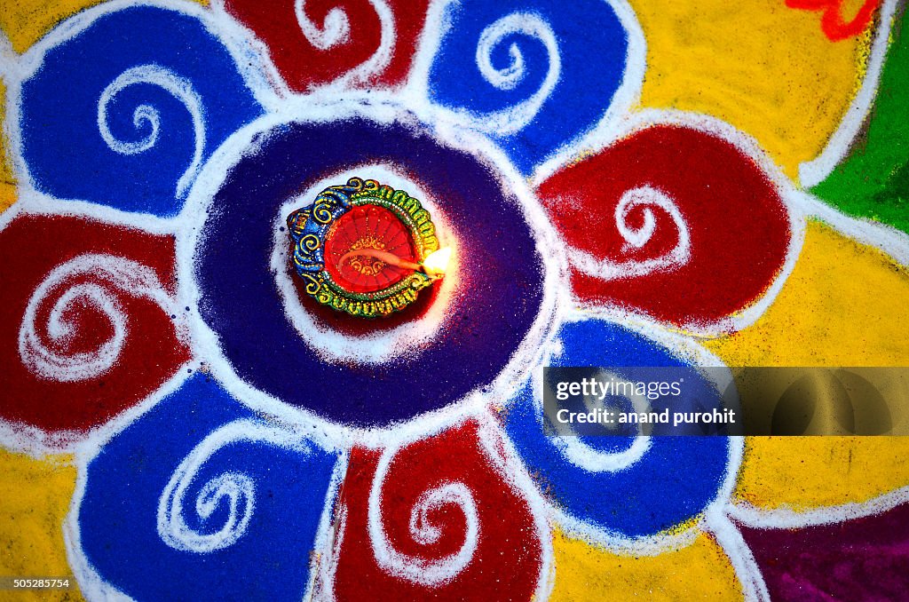 Colourful Rangoli with diya, Diwali Festival, India