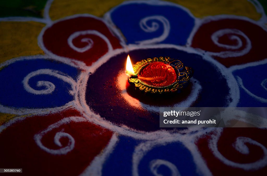 Colourful Rangoli with diya, Diwali Festival, India