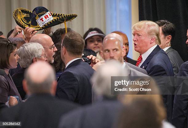 Republican presidential candidate Donald Trump greets guests after speaking at the 2016 South Carolina Tea Party Coalition Convention on January 16,...