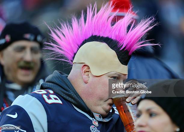 Fan drinks a beer during pre-game activity. The New England Patriots hosted the Kansas City Chiefs in an AFC divisional playoff game at Gillette...