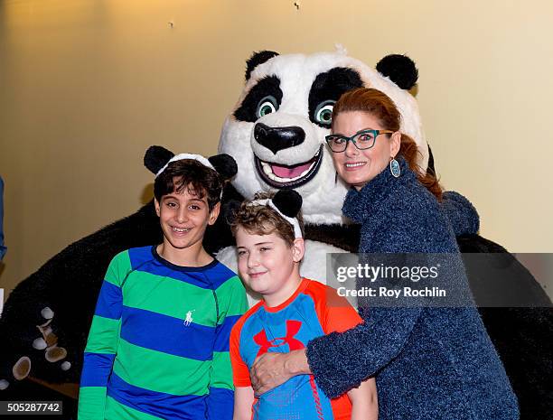 Roman Walker Zelman and Debra Messing attend the "Kung Fu Panda 3" New York screening at AMC Loews Kips Bay 15 theater on January 16, 2016 in New...