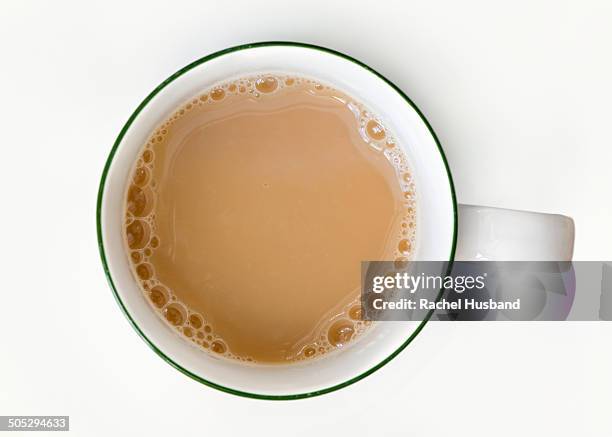 freshly poured cup of tea from above - tea cup stock pictures, royalty-free photos & images