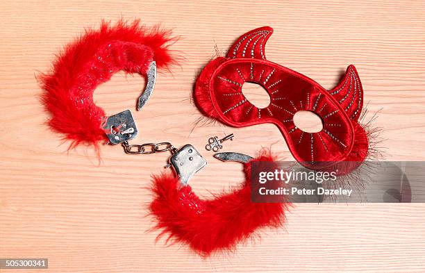 fetisch mask and handcuffs - kinky stock pictures, royalty-free photos & images