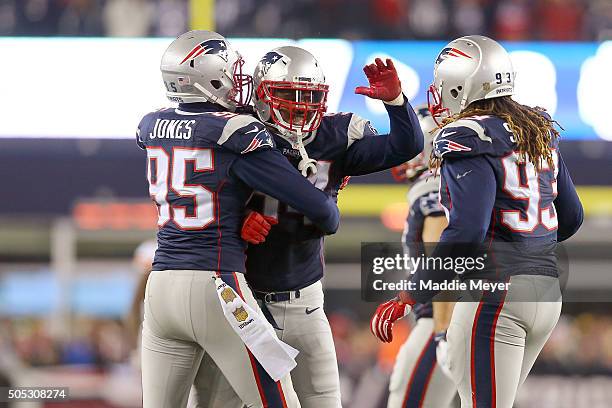 Dont'a Hightower of the New England Patriots celebrates with Chandler Jones and Jabaal Sheard after a play in the second half against the Kansas City...