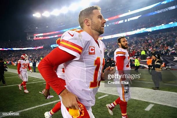 Alex Smith of the Kansas City Chiefs runs off the field after being defeated by the New England Patriots during the AFC Divisional Playoff Game at...