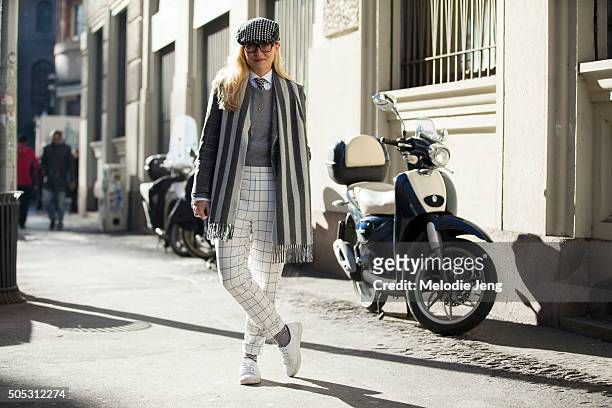 Sarah Ann Murray of The Rake wears a bespoke trousers and pants and a Drakes scarf during the Milan Men's Fashion Week Fall/Winter 2016/17 on January...