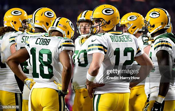 Quarterback Aaron Rodgers of the Green Bay Packers looks to the sideline during the first half of the NFC Divisional Playoff Game against the Arizona...