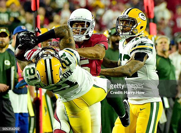 Free safety Ha Ha Clinton-Dix of the Green Bay Packers hauls in a third quarter interception over wide receiver Michael Floyd of the Arizona...